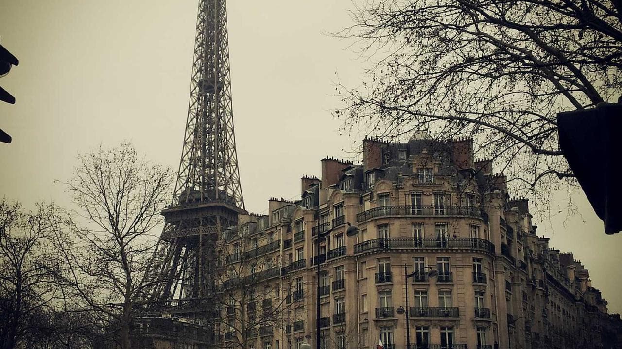 A workbench with electronic components and tools.